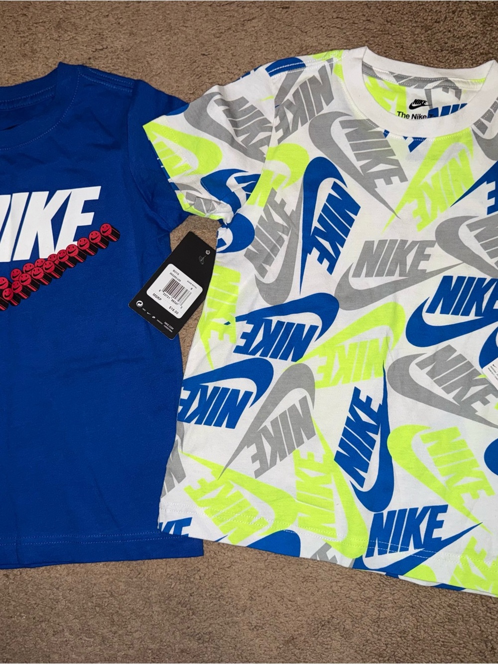 Nike Kids' Short-Sleeve Logo Tee in White/Blue/Neon and a blue tee